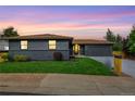 Updated ranch home with gray exterior and manicured lawn at 9663 Meade Ct, Westminster, CO 80031