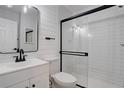 Updated bathroom with white subway tile and a glass shower at 155 S Sable Blvd # S26, Aurora, CO 80012