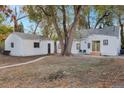 Spacious backyard with detached garage and mature trees at 3545 W Custer Pl, Denver, CO 80219