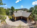 Beautiful home showcasing a spacious three-car garage and appealing exterior design at 648 Ruby Trust Dr, Castle Rock, CO 80108