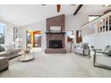 Living room with fireplace, high ceiling and lots of light at 16587 W 53Rd Way, Golden, CO 80403