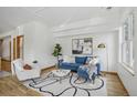 Bright living room with contemporary decor, stylish rug, and a comfortable blue sofa at 4632 14Th St, Boulder, CO 80304