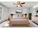 Serene main bedroom featuring a comfortable bed, stylish lamps, and a spacious layout with ample natural light at 7434 Singing Hills Ct, Boulder, CO 80301