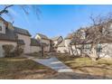 Exterior view of townhouses with landscaping and a walkway at 2181 S Victor St # D, Aurora, CO 80014