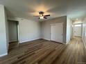 Open-concept living room featuring neutral color palette, ceiling fan and tons of natural light at 9476 Yampa Ct, Commerce City, CO 80022