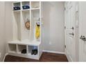 Practical mud room featuring custom built-ins, ample storage, and hooks for organizing at 15079 E Poundstone Pl, Aurora, CO 80015