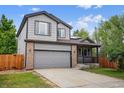 Charming two-story home with gray siding, brick accents, and a two-car garage at 4333 E Bennington Ave, Castle Rock, CO 80104