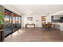 Bright living room with hardwood floors and sliding glass doors to balcony at 100 Park W Ave # 604, Denver, CO 80205