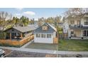 Charming home featuring a modern exterior with a cozy front yard and fresh, white paint at 2461 Depew St, Edgewater, CO 80214