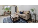 Comfortable living room with stylish decor, plush sofa, and ample natural light at 9195 E Lehigh Ave # 162, Denver, CO 80237
