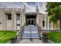 Morningside Club House entrance with double doors and well-maintained landscaping at 6940 E Girard Ave # 307, Denver, CO 80224