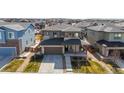 Aerial view showcasing a well-maintained home in a Gathering-friendly neighborhood with manicured lawns at 420 Pleades Pl, Erie, CO 80516