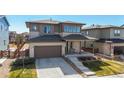 Beautifully designed home with stone accents, a covered porch, and an inviting entrance at 420 Pleades Pl, Erie, CO 80516