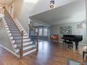 Inviting living room features hardwood floors, a staircase, and ample natural light at 126 Mc Intyre Circle, Golden, CO 80401