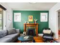 Bright living room featuring a fireplace and stylish decor at 1169 Cook St, Denver, CO 80206