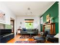 Bright living room featuring a fireplace and stylish decor at 1169 Cook St, Denver, CO 80206