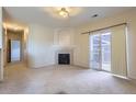 Living room featuring a fireplace and sliding glass doors at 8200 E 8Th Ave # 2102, Denver, CO 80230