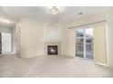 Living room with fireplace and sliding glass door at 8200 E 8Th Ave # 2102, Denver, CO 80230