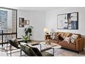 Bright living room with modern décor, comfortable seating, and cityscape view, creating a stylish urban retreat at 1625 Larimer St # 1806, Denver, CO 80202