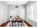 Dining room with a large table, seating for eight, and natural light from the window at 424 N Clarkson St, Denver, CO 80218