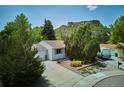 Aerial view of the home showcasing the driveway, landscaping, and surrounding neighborhood at 800 Park View Pl, Castle Rock, CO 80104