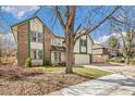 Classic two-story house with brick detailing, an attached garage, and a well-groomed front yard at 12258 E Lasalle Pl, Aurora, CO 80014