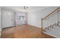 Living room features hardwood floors and staircase at 1628 Chester St, Aurora, CO 80010