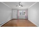 Spacious living room with hardwood floors and ceiling fan at 1628 Chester St, Aurora, CO 80010