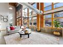 Bright living room featuring floor-to-ceiling windows and exposed brick at 2955 Inca St # 1D, Denver, CO 80202