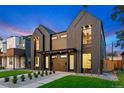 Modern two-story homes feature striking dark wood siding, professional landscaping, and inviting front entrances at 2478 S Cherokee St, Denver, CO 80223