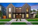 Modern two-story homes feature striking dark wood siding, professional landscaping, and inviting front entrances at 2478 S Cherokee St, Denver, CO 80223