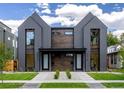 Symmetrical modern duplex with striking architectural details, stylish landscaping, and a welcoming entrance at 2478 S Cherokee St, Denver, CO 80223
