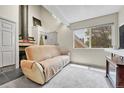Cozy living room with a large window providing natural light and scenic outdoor views at 8701 Huron St # 211, Thornton, CO 80260
