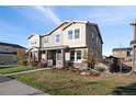 Beautiful two-story townhome with landscaping and front porch at 3061 Low Meadow Blvd, Castle Rock, CO 80109