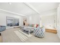 Spacious living room with gray sectional sofa and large windows at 3257 S Pontiac St, Denver, CO 80224