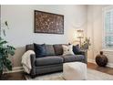 Comfortable living room with sofa, decorative pillows, and natural lighting at 22065 E Bailey Pl, Aurora, CO 80016