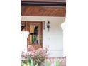 Close-up of a classic front door with wood trim and visible house number: 1220 at 1220 S Vine St, Denver, CO 80210