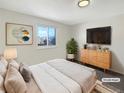 Comfortable bedroom featuring a large window, modern decor, and stylish furnishings at 14423 E 47Th Ave, Denver, CO 80239