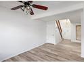 Bright living room with wood floors and a contemporary ceiling fan at 2082 S Helena St # C, Aurora, CO 80013