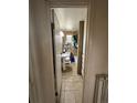 A compact bathroom with essential fixtures including a pedestal sink, toilet, and tiled shower/tub combination at 1255 Yates St, Denver, CO 80204