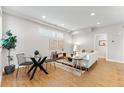 Bright and airy living room with stylish decor and hardwood floors at 1245 N Utica St # 103, Denver, CO 80204