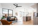 Relaxing living room featuring recessed lighting, modern furniture and large windows at 3433 Lawrence St # 1, Denver, CO 80205