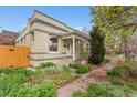 Inviting home exterior with stone pathway, garden and charming front porch at 2339 Lowell Blvd, Denver, CO 80211