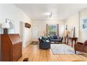 Bright living room with hardwood floors, plenty of natural light and classic decor at 2339 Lowell Blvd, Denver, CO 80211