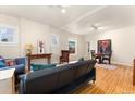 Open-concept living area with hardwood floors, comfortable seating, and dining space at 2339 Lowell Blvd, Denver, CO 80211