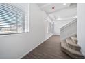 Bright entryway with stairs leading upstairs and a view of a window at 16142 E 111Th Dr, Commerce City, CO 80022