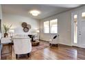 Cozy living room showcasing hardwood floors, neutral tones, and stylish decor at 7353 S Queensburg St, Aurora, CO 80016