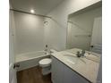 Modern bathroom with white subway tiles, a large vanity, and a shower-tub combination at 22057 E 39Th Pl, Aurora, CO 80019