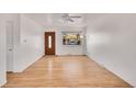 Bright and airy living room with hardwood floors, a ceiling fan, and a large window at 435 S 42Nd St, Boulder, CO 80305