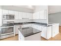 Modern kitchen with stainless steel appliances and granite countertops at 70 W 6Th Ave # 109, Denver, CO 80204